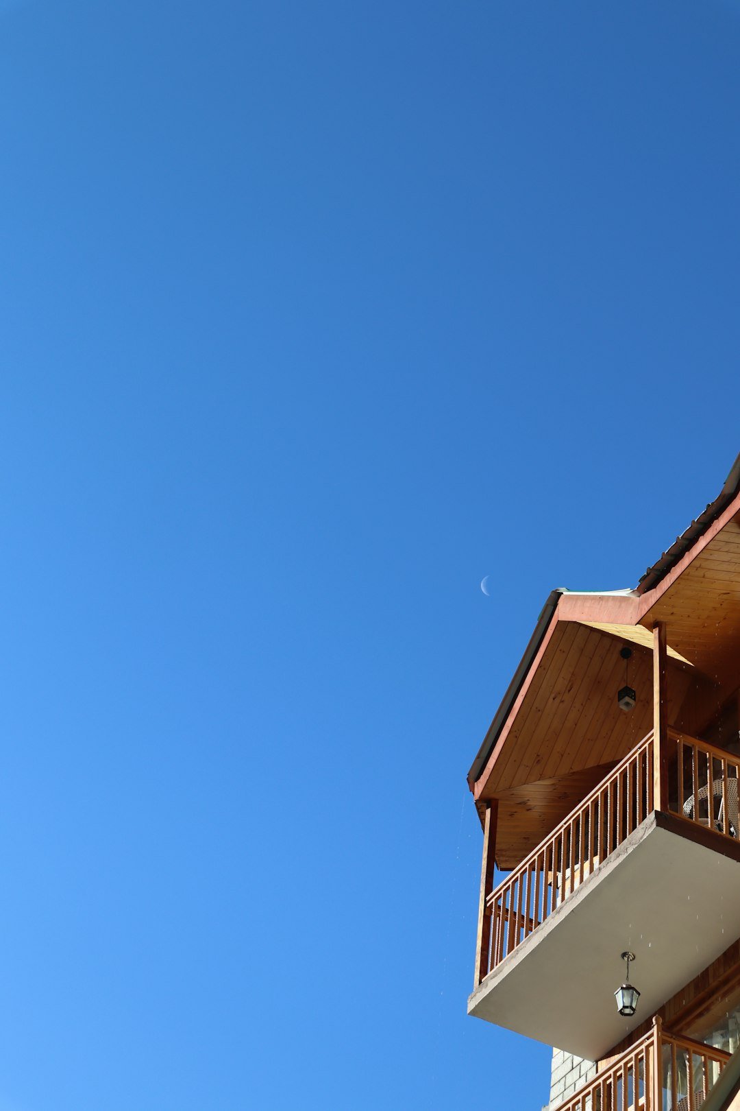 a tall building with a balcony and balconies