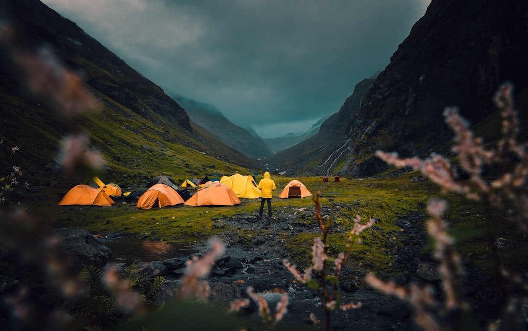 a group of tents pitched up in a valley