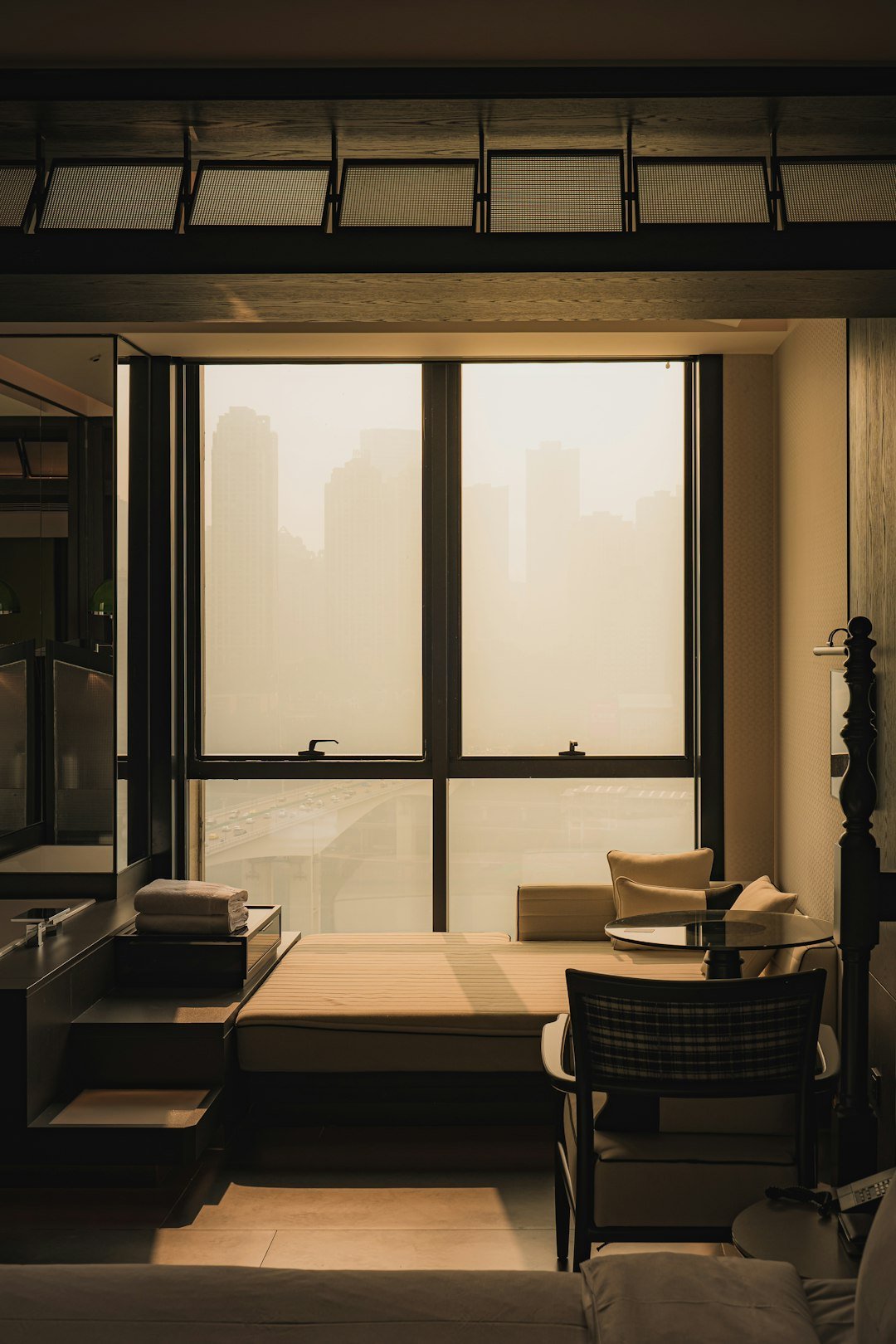 A living room filled with furniture and a large window