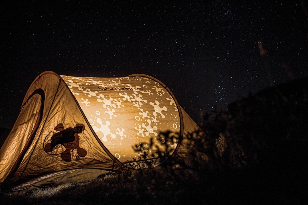 yellow tent with lights during night time