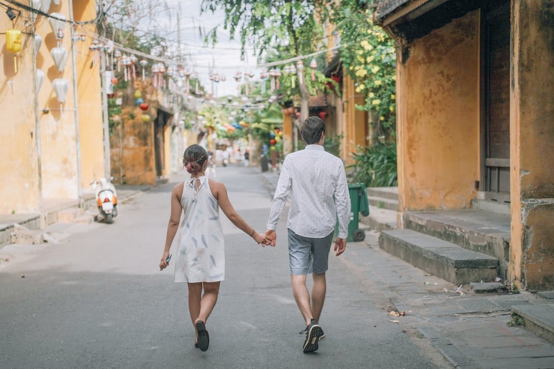 a man and a woman walking down a street