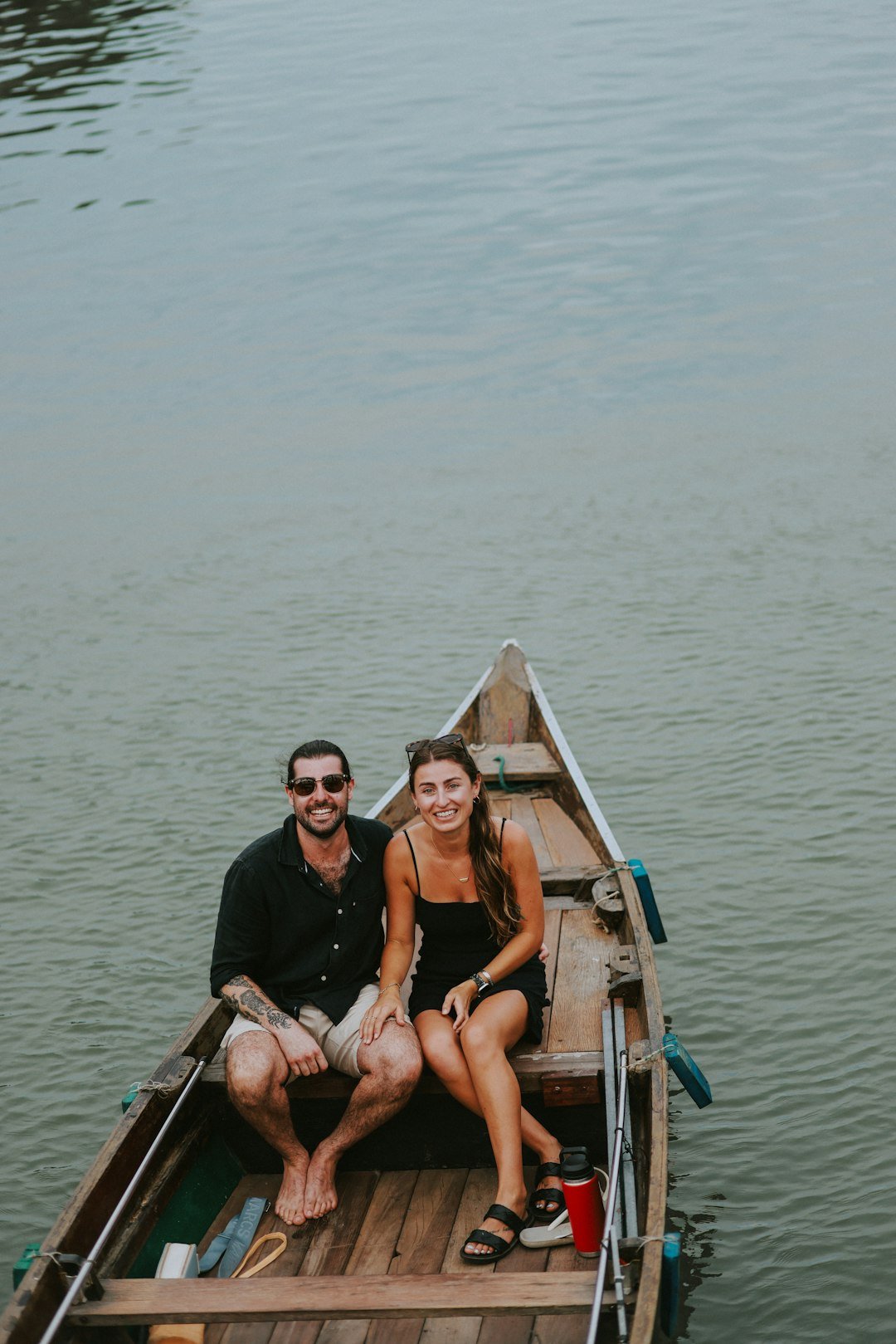 a man and a woman are sitting in a boat