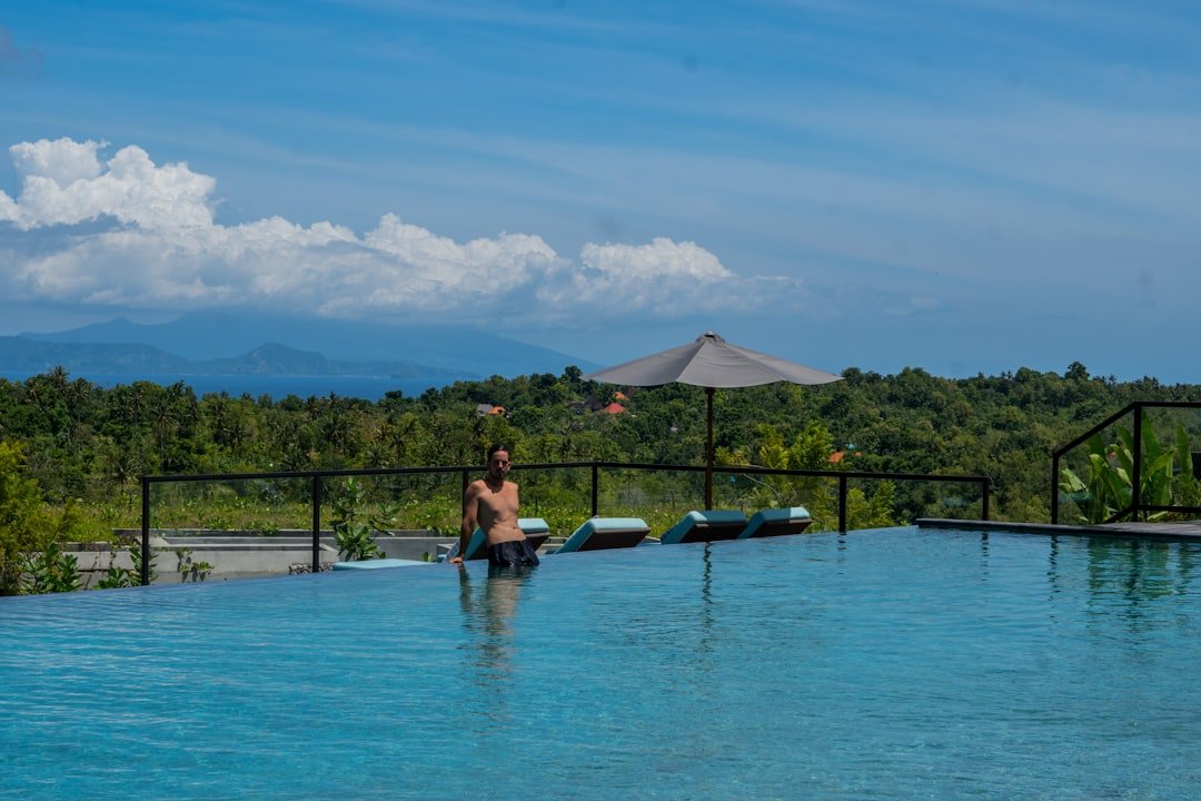 A person standing in the middle of a swimming pool