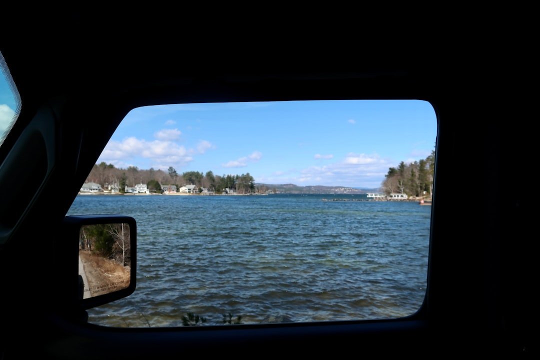 A view of a body of water from inside a vehicle