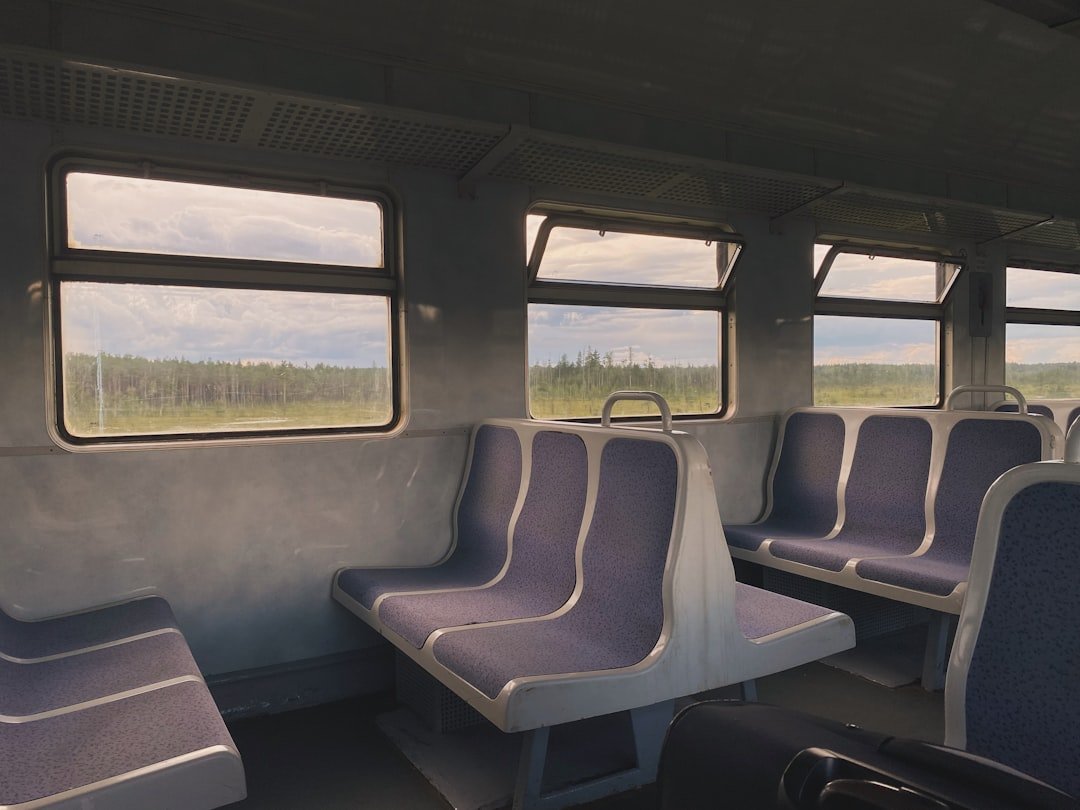 A train car filled with lots of empty seats