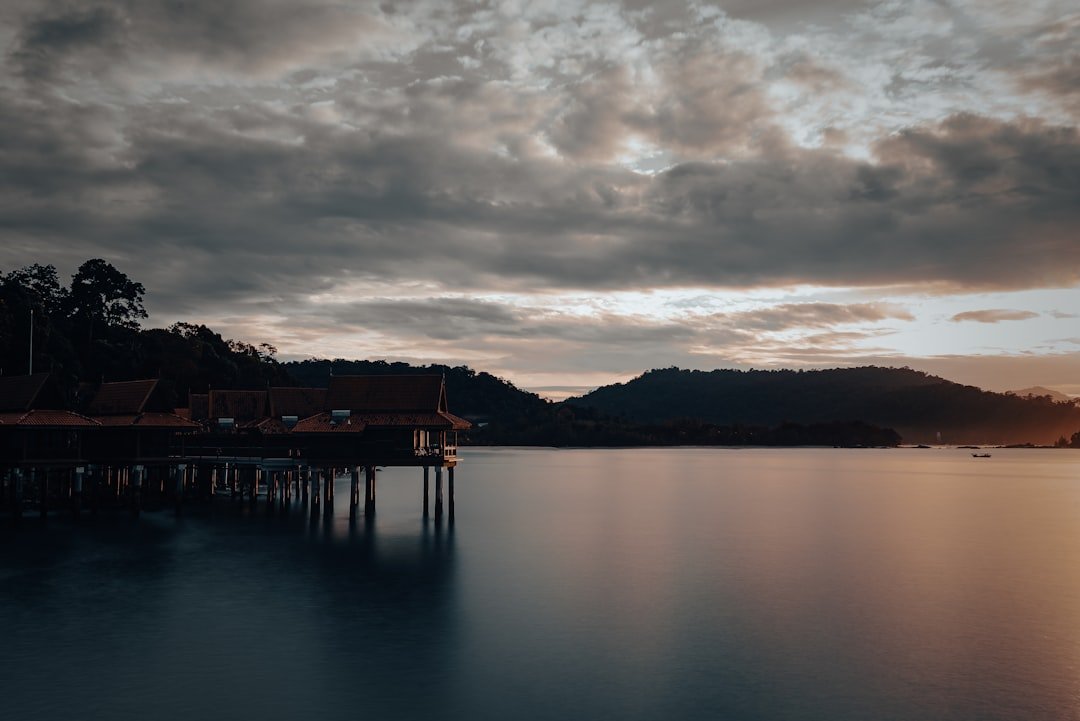a body of water with a boat in the distance