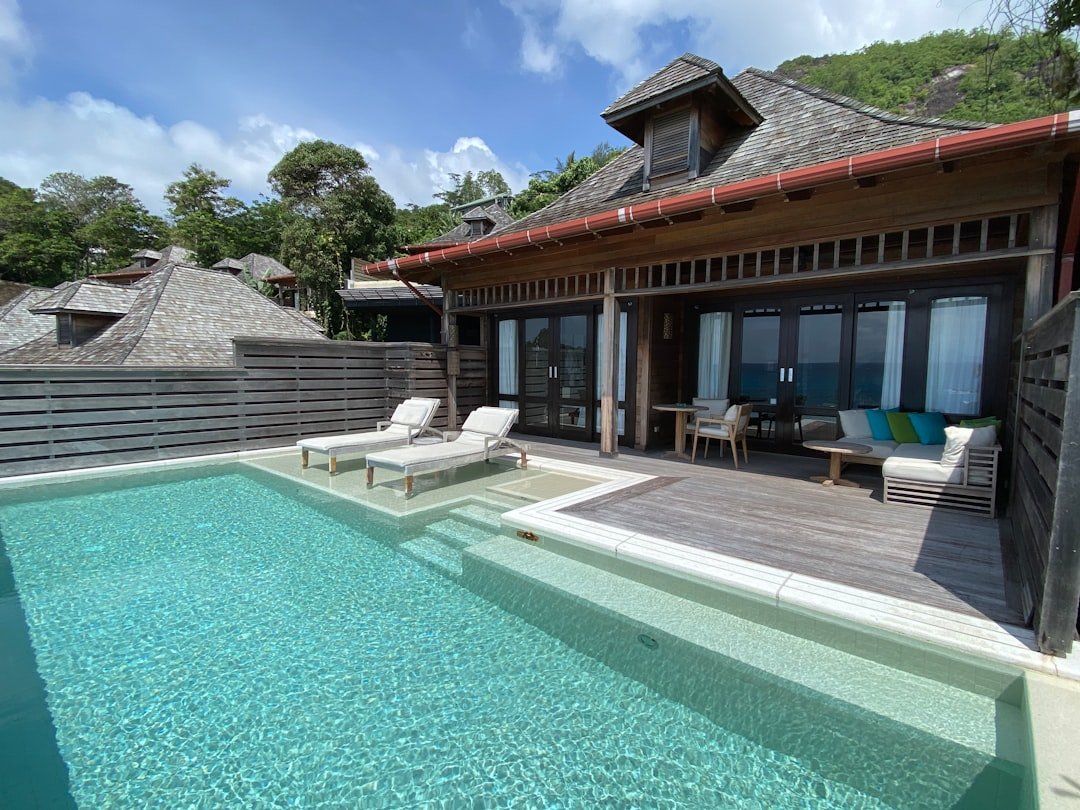 a house with a swimming pool in front of it