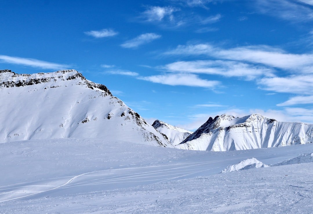 a person skiing down a snow covered mountain