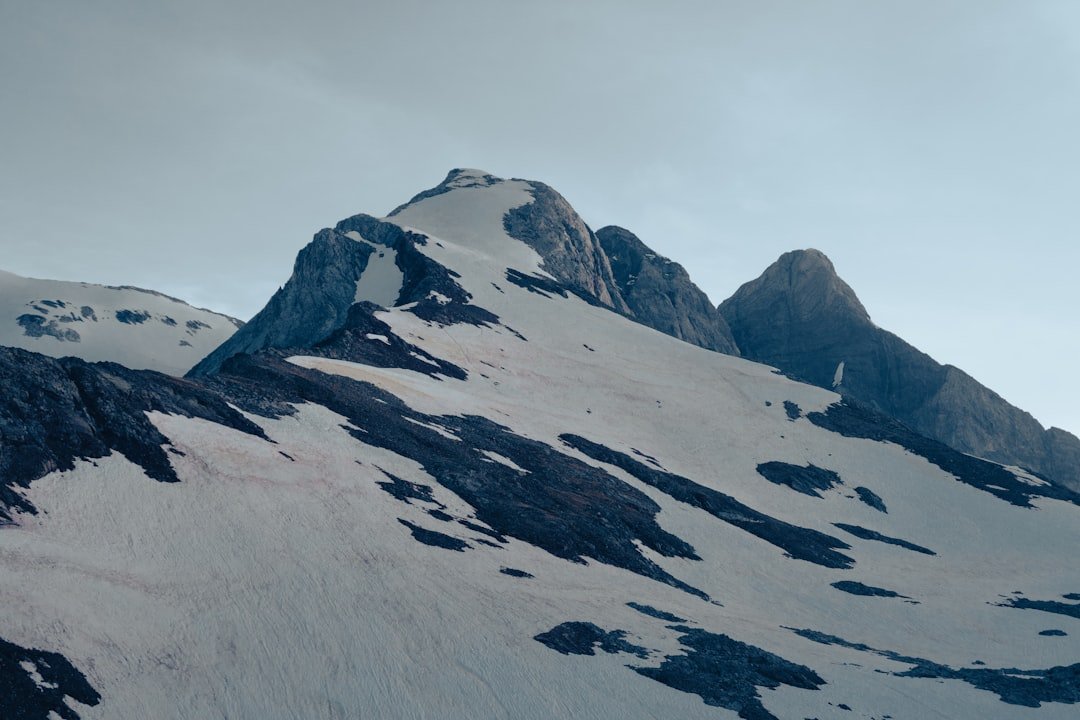 snow covered mountain during daytime
