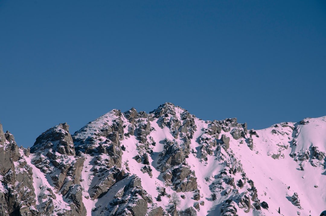 a snow covered mountain with a sky background