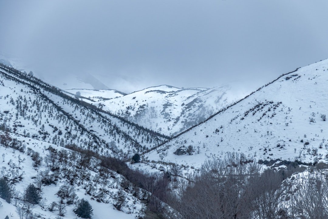 snow covered mountain during daytime