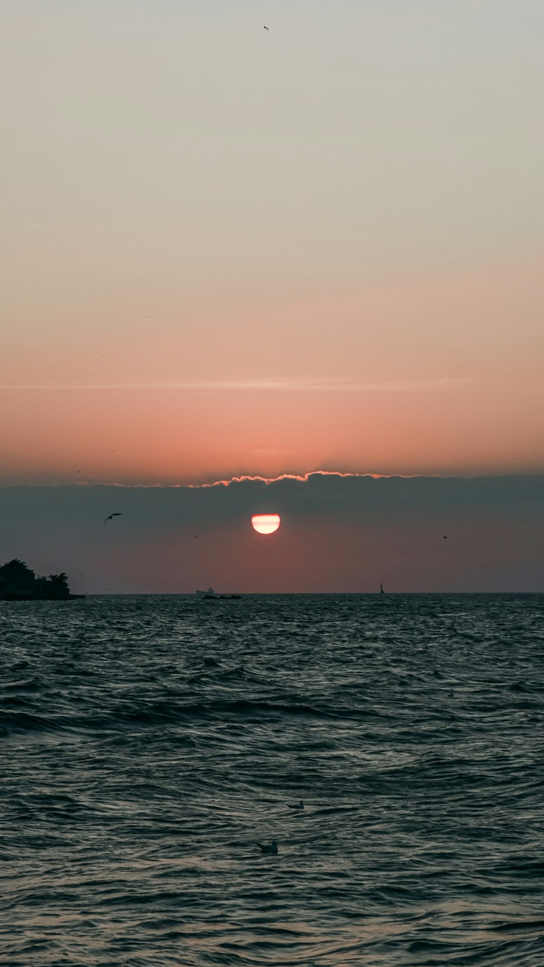 a body of water with a sunset