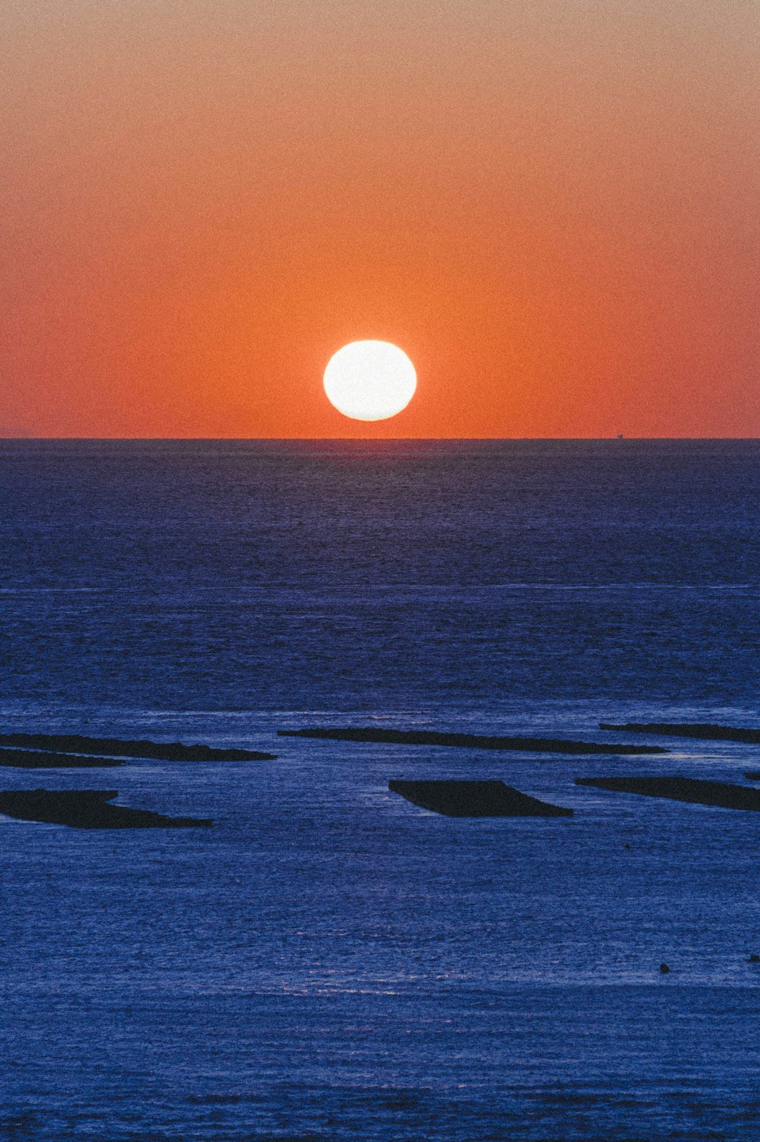 body of water during sunset