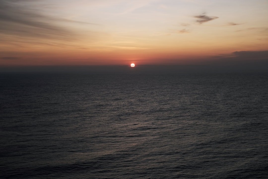 a sunset over a body of water