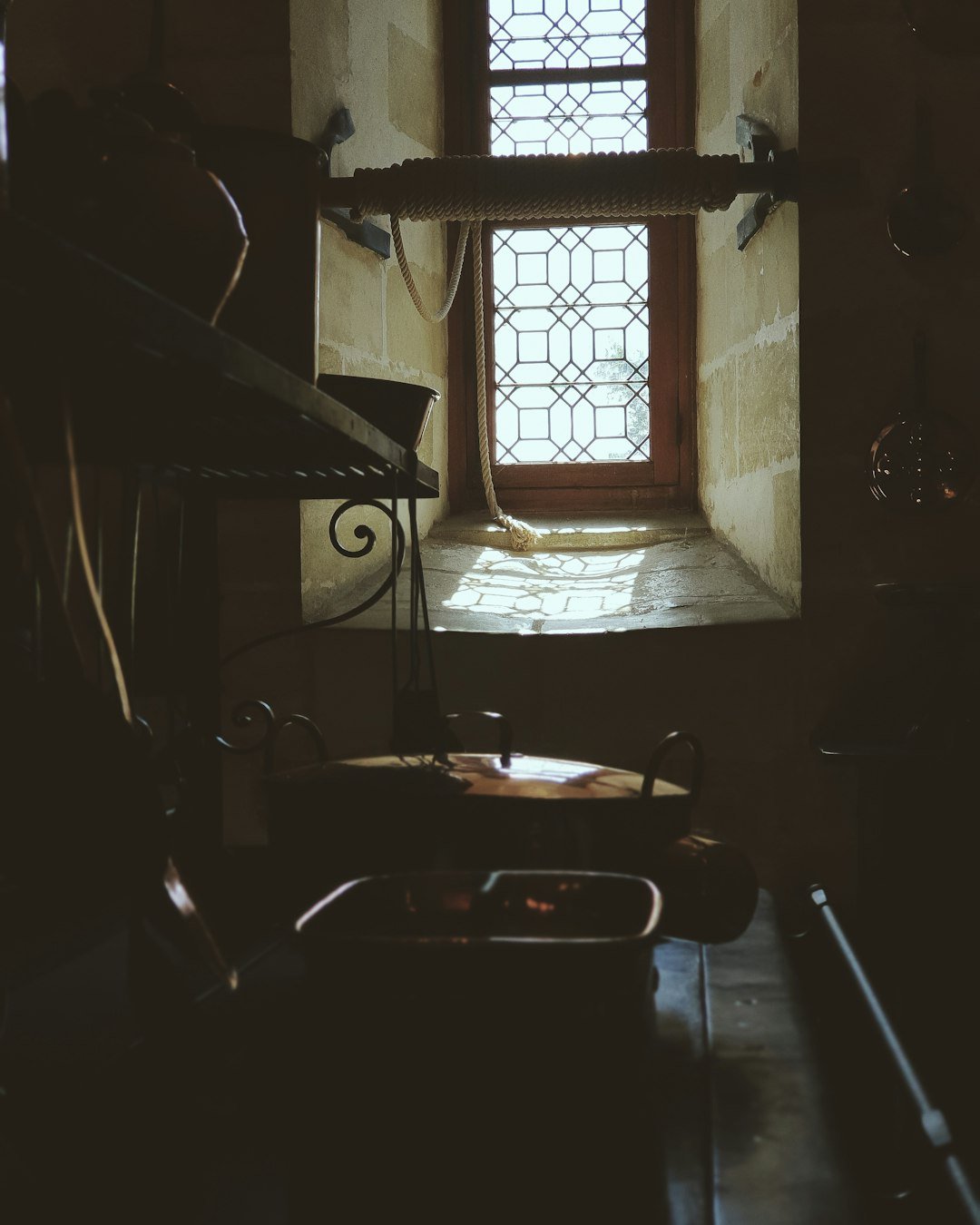 black metal bed frame near window